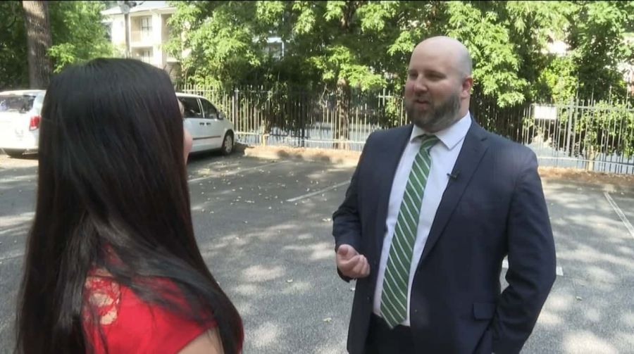 Tom Church being interviewed on the street